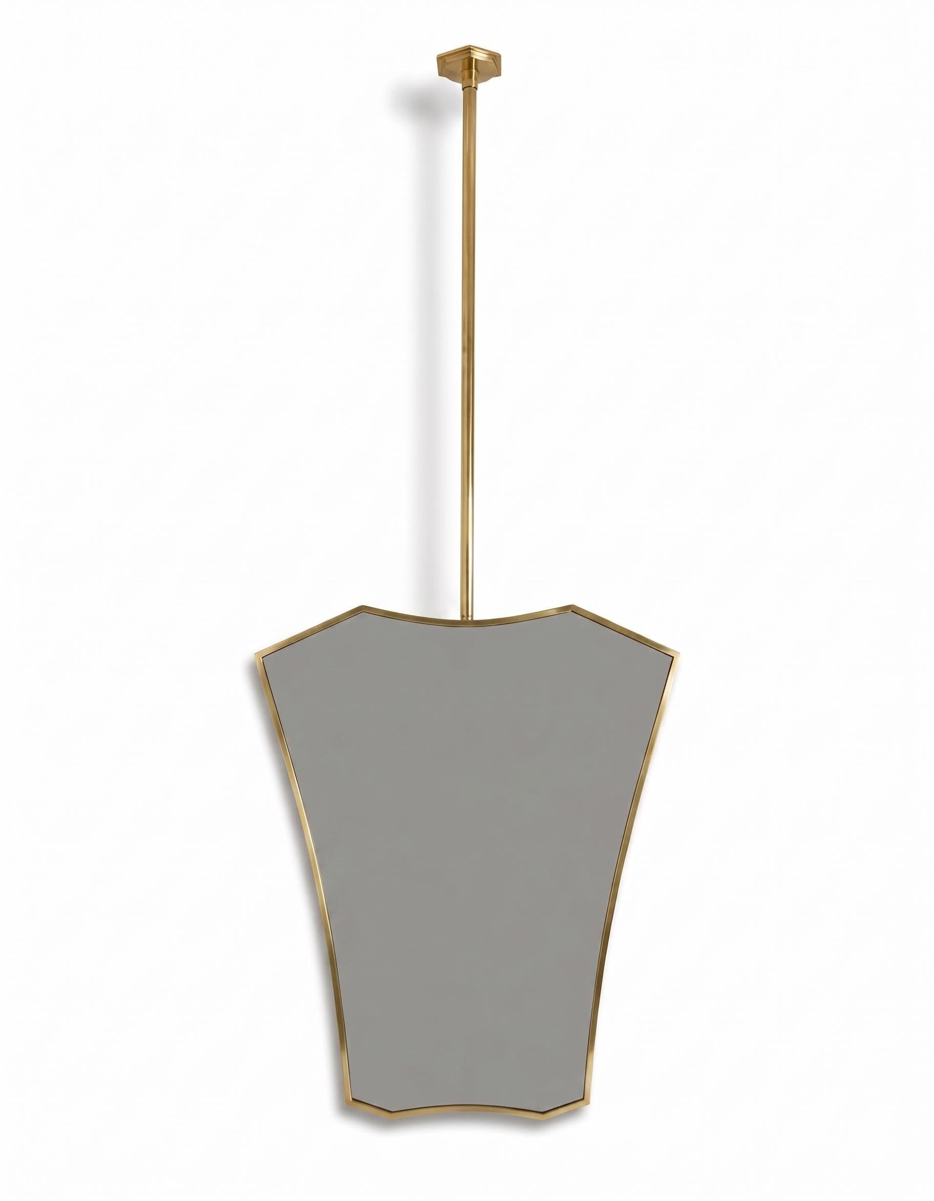 Modern hanging brass mirror on white background