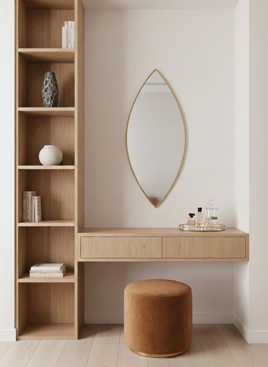 Pointed oval brass mirror in modern dressing nook