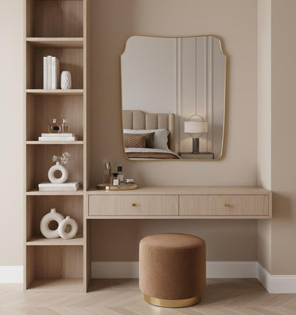 Handmade curved brass mirror above modern vanity desk