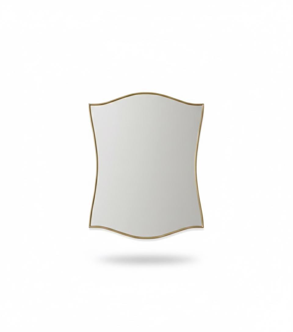Scalloped brass wall mirror with curved edges in a white background