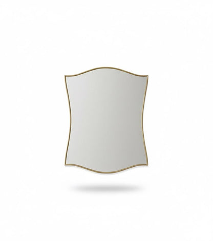 Scalloped brass wall mirror with curved edges in a white background