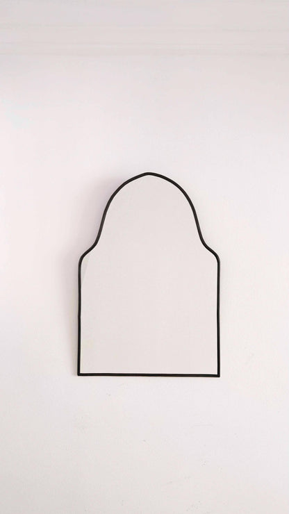 black arch brass mirror in white background
