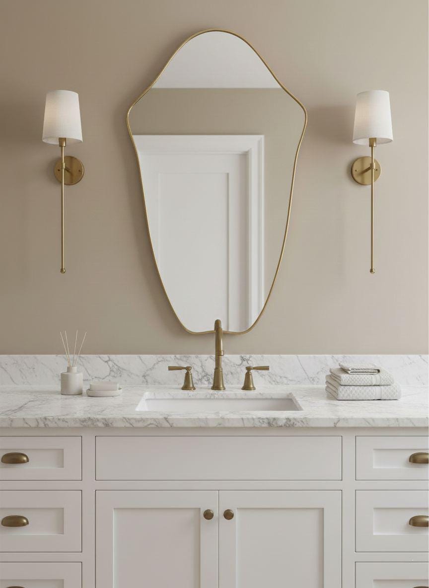 Handcrafted irregular brass mirror over marble bathroom vanity