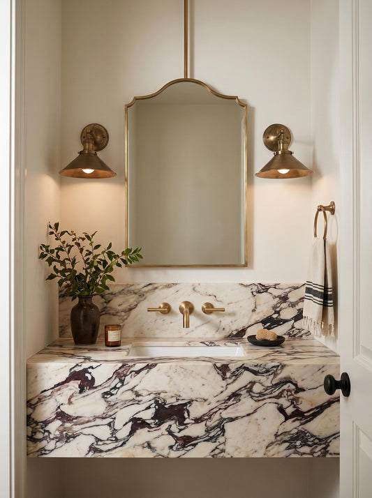 Ceiling mounted brass mirror in minimalist marble bathroom