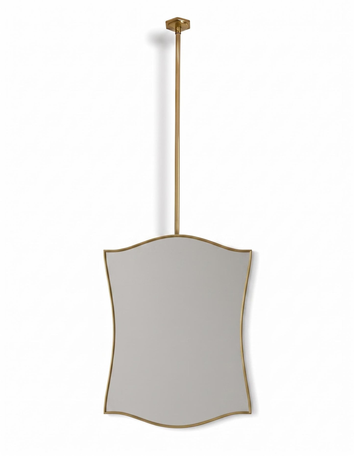 Suspended sculptural brass mirror on white background