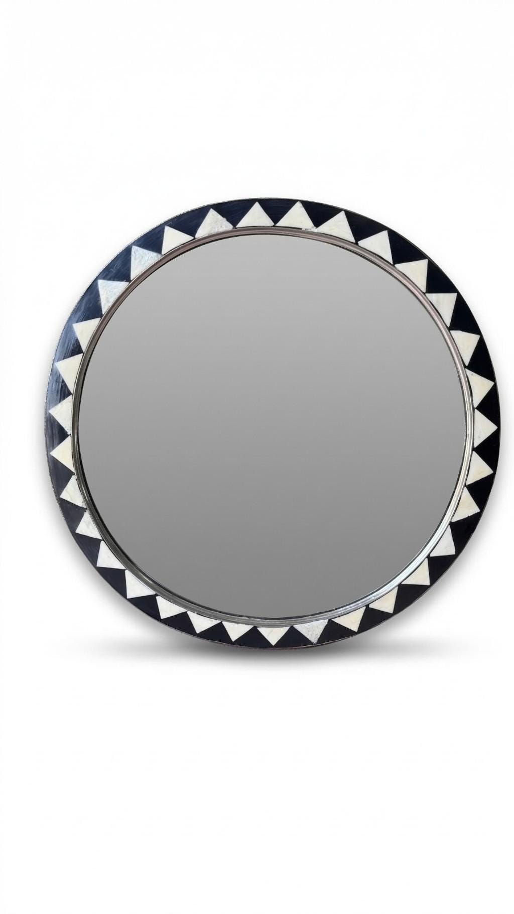 Close-up of Moroccan round mirror with black and white triangle inlay detail
